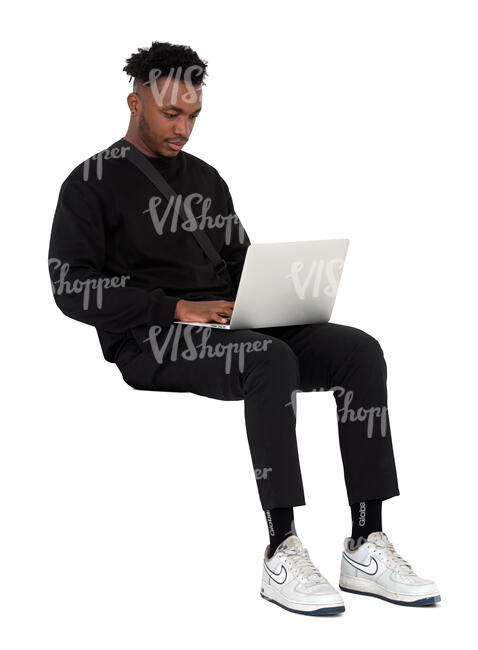 man sitting and working with a laptop