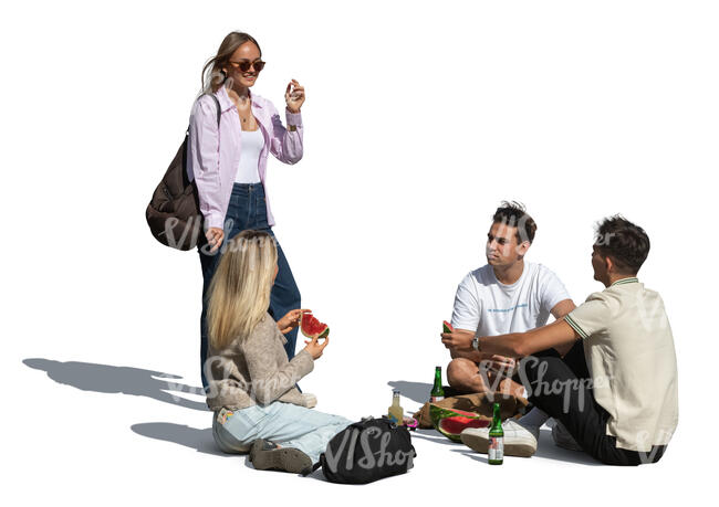 cut out group of friends having a picnic and eating a watermelon