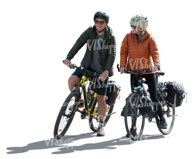 two people with travel bikes stopping in backlight