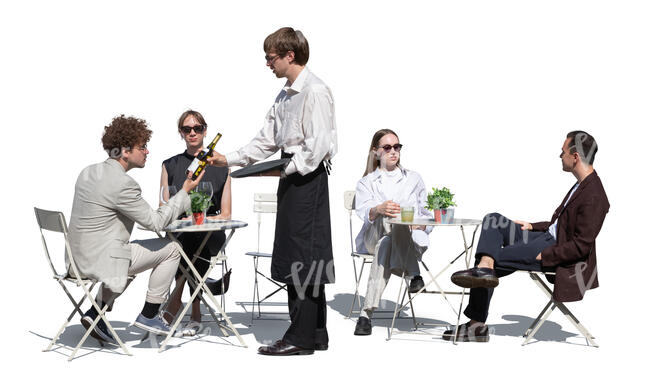 outdoor restaurant with a waiter showing wine to customers