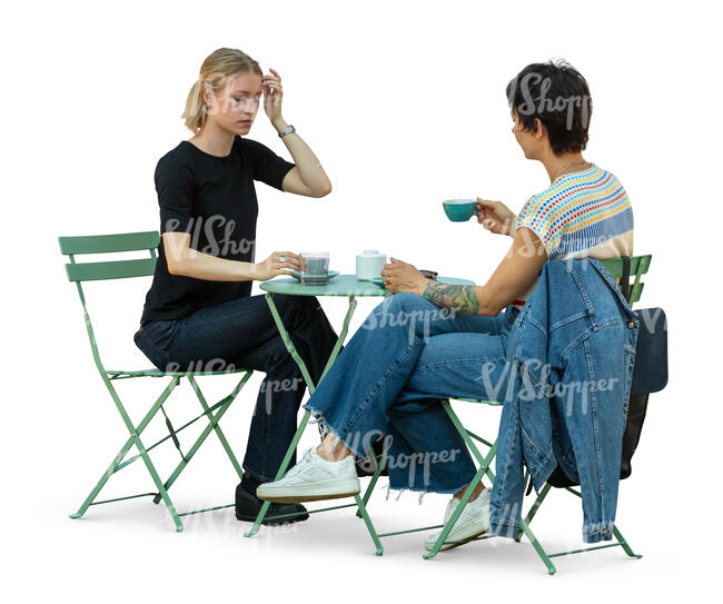 two women sitting in a cafe and drinking coffee
