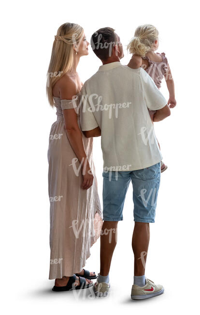 man and woman with a little child standing by the window and looking outside