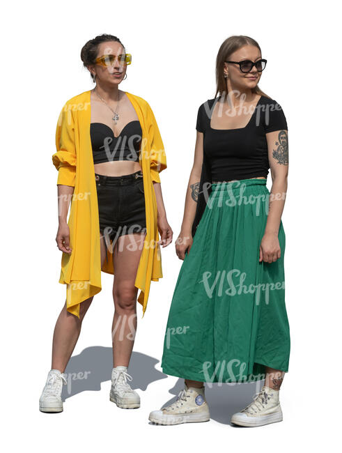 two women standing and looking at smth