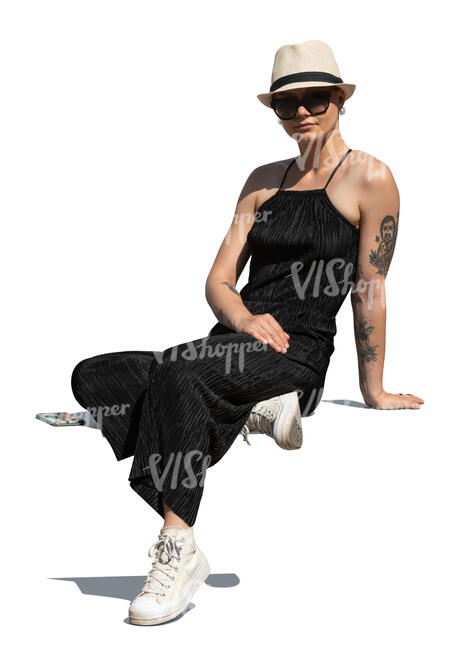 woman with a hat sitting in sunlight
