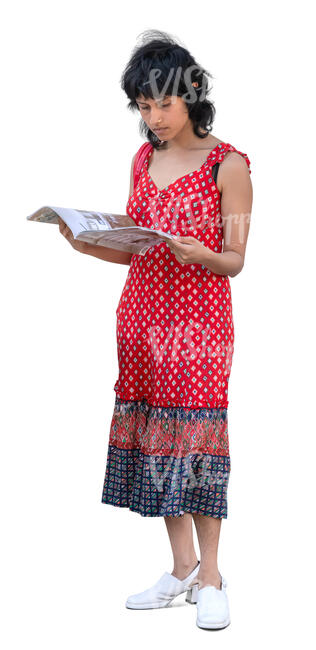indian woman standing and reading a magazine