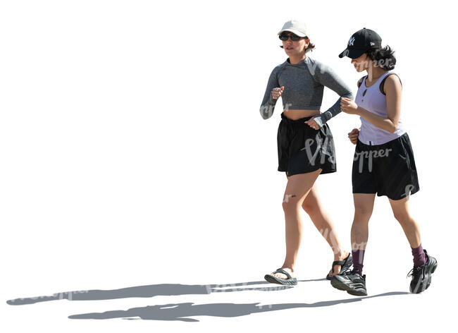 backlit women jogging in the street