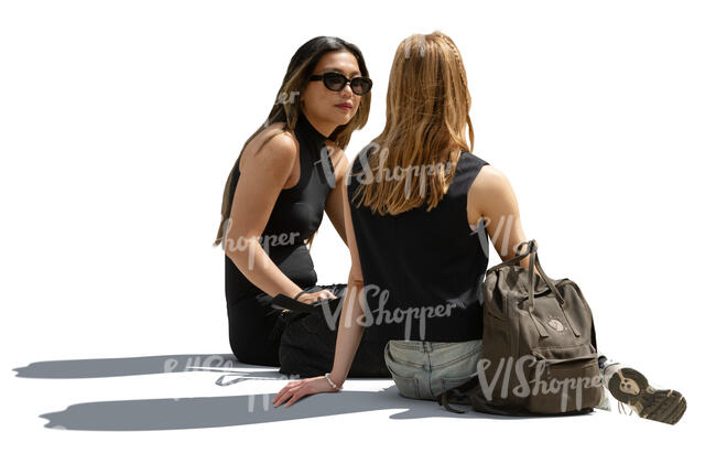 two cut out women sitting and talking