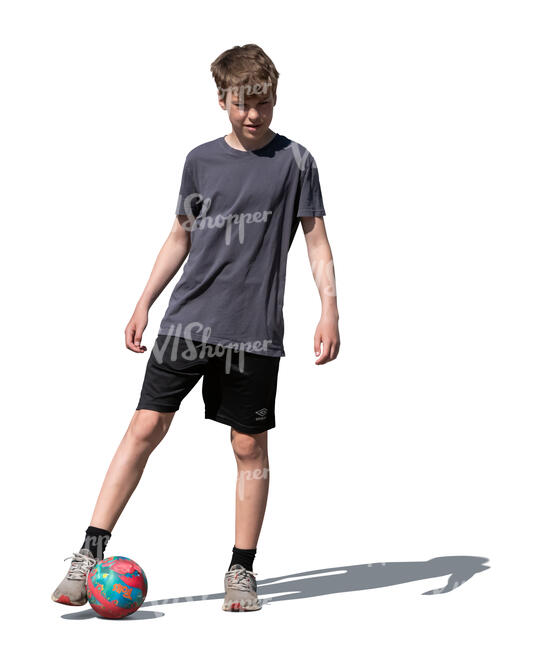 cut out boy playing football outside in the sunlight