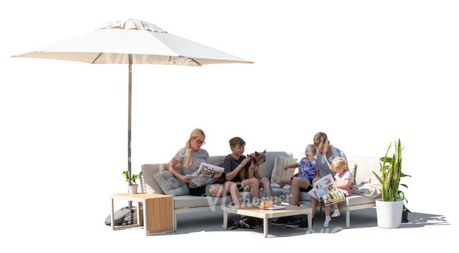 family sitting on a terrace on a sofa under a parasol