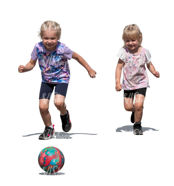 two little children running after a ball
