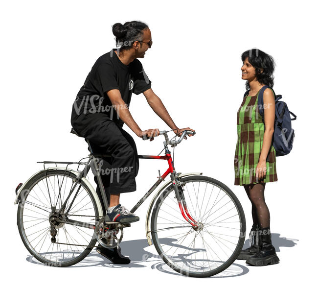 indian man with a bike talking to a female friend