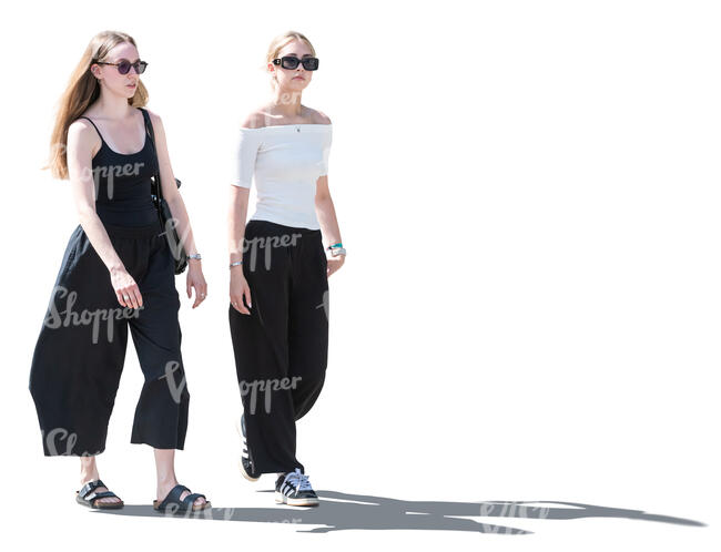 two cut out women walking in backlight