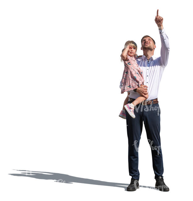 man holding her daughter and pointing up in the sky