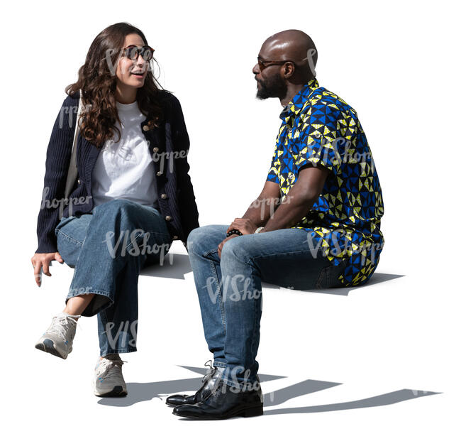 man and woman sitting outside and talking