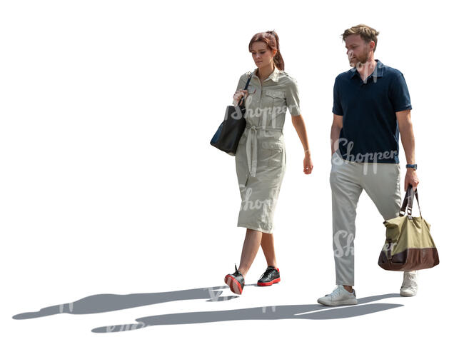 man and woman walking in backlight