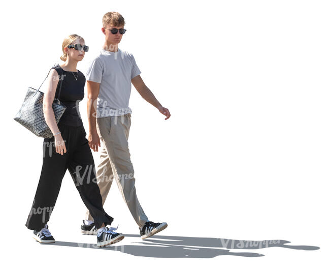 backlit man and woman walking