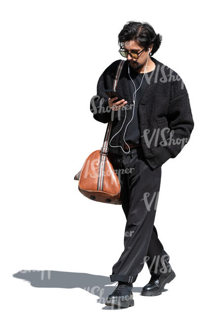 cool indian man walking and listening to music