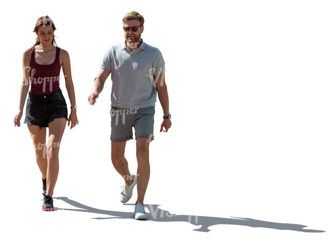man and woman walking in the summer in backlight