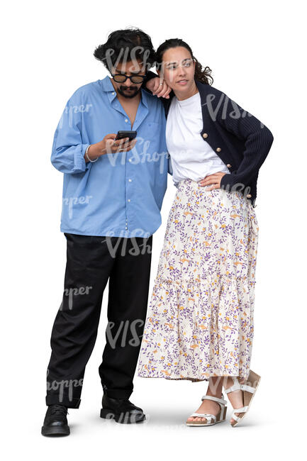 man and woman standing together while man is looking at his phone