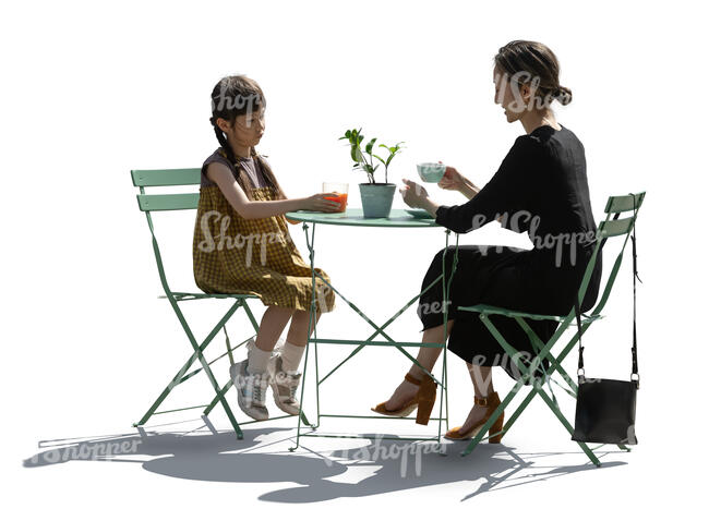 backlit scene of an asian woman and child sitting in a cafe