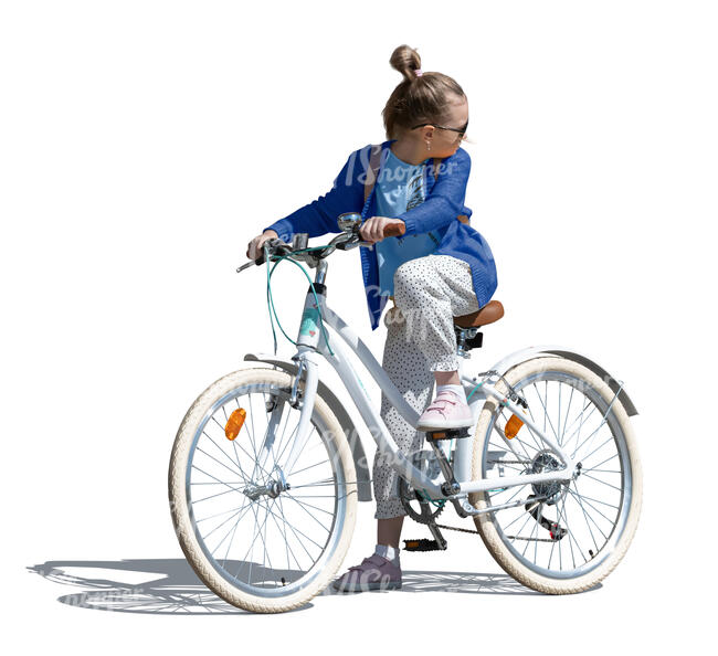 girl riding a bicycle and looking back over her shoulder