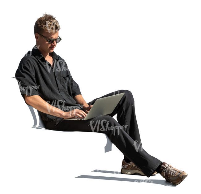 man casually sitting and working with a laptop