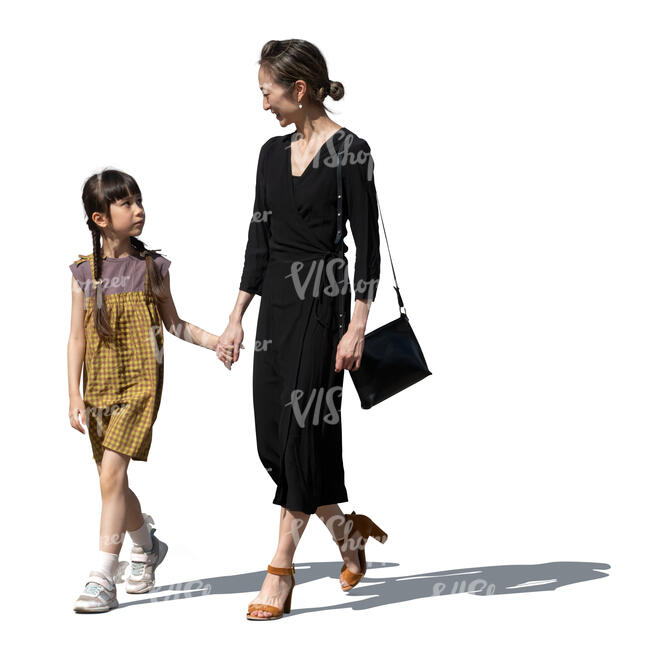 asian woman and child walking hand in hand
