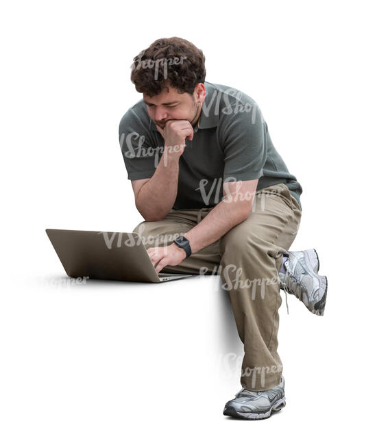 man working with a laptop on a bench