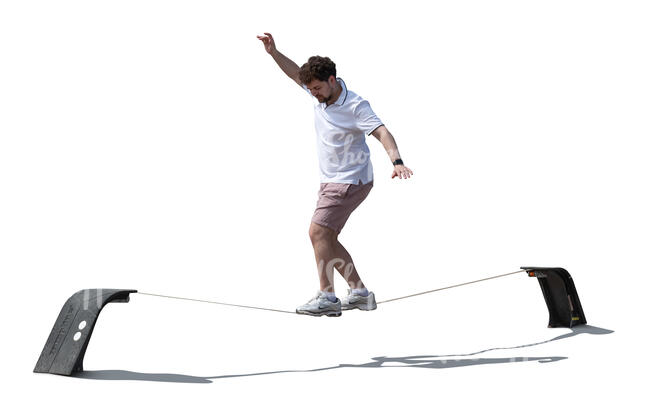cut out man walking on a slackline