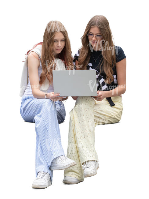 two teenage girl with a laptop sitting