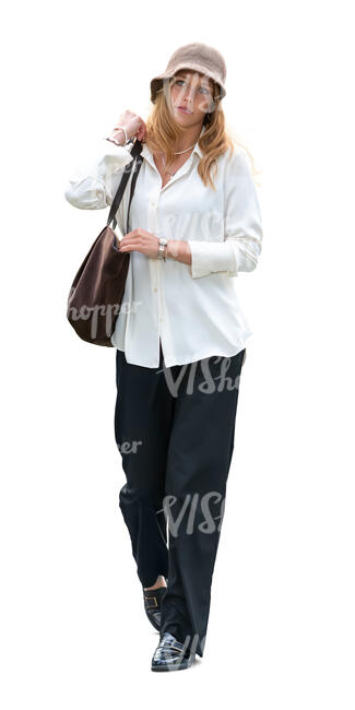woman with a hat and wearing a white shirt walking