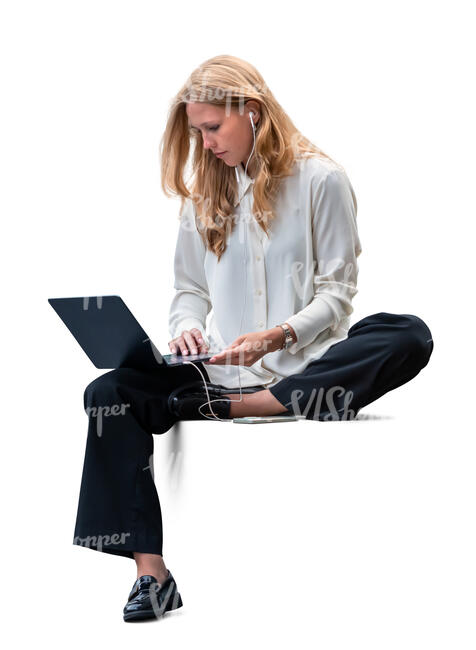 woman with a laptop and headphones sitting