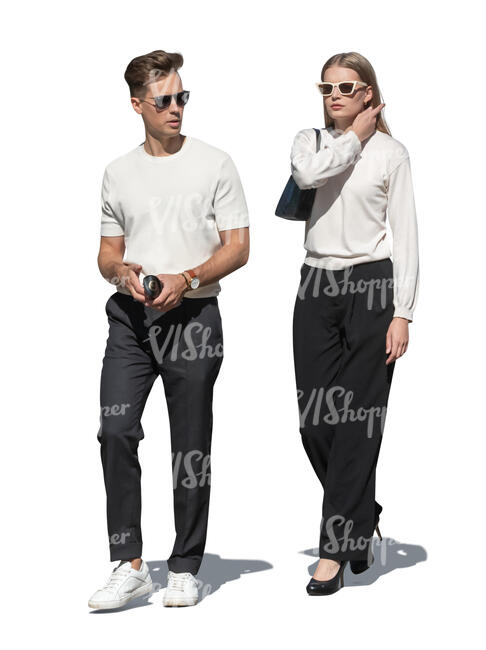 two people walking in the sunlight