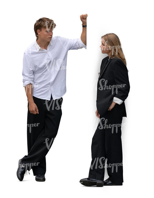 man leaning against the wall and talking to a woman