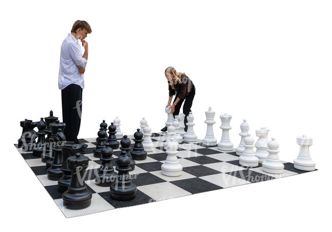two people playing giant chess in the street
