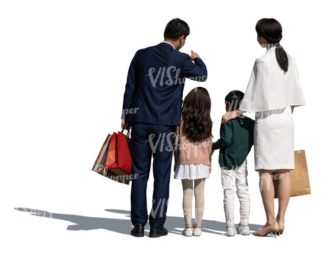 chinese family with two kids standing and looking at smth