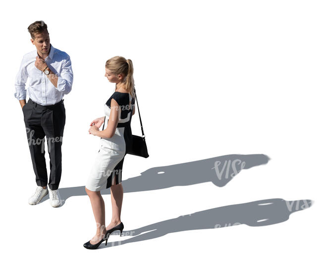 top view of two elegant people standing outside and talking