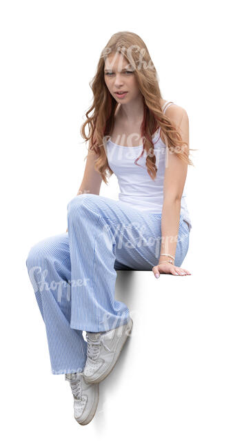 teenage girl sitting casually on a balustrade