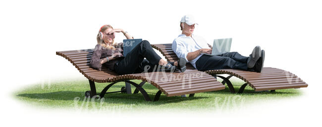 two tech people lying on outdoor chairs and working with laptops