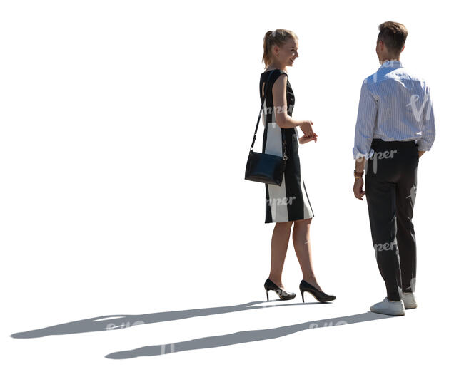 two elegant backlit people standing and talking