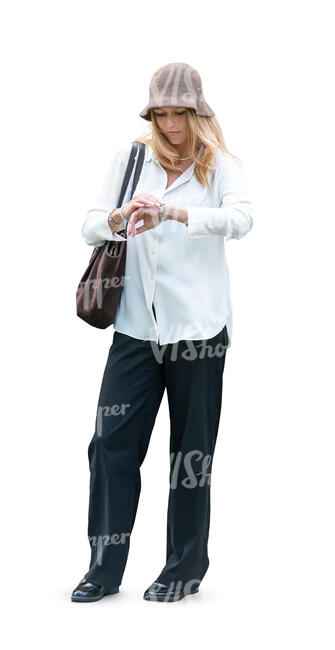 woman standing and looking at her wrist watch