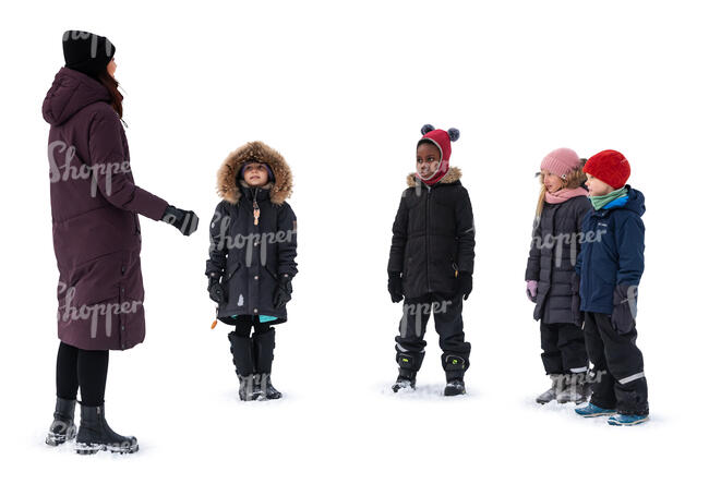 group of children in the winter listening to their teacher