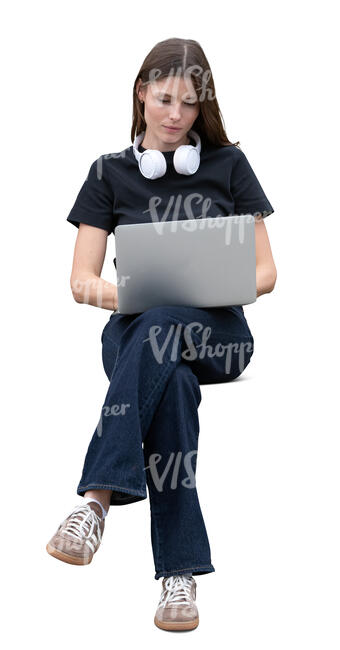woman sitting and working with a laptop