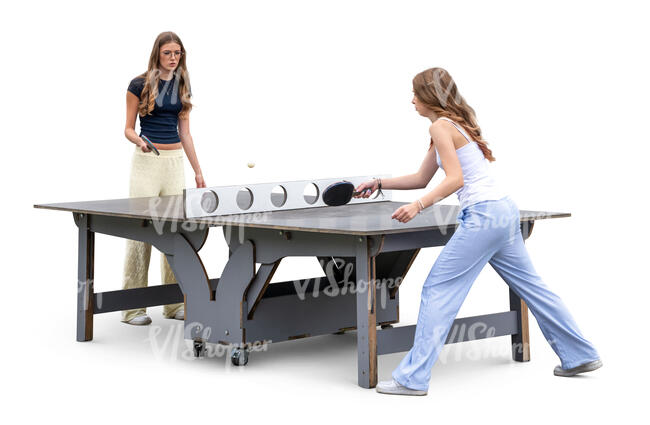 two teenage girls playing table tennis