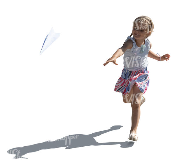 backlit girl playing with paper plane
