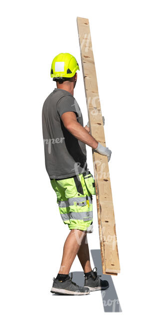 construction worker carrying wood boards