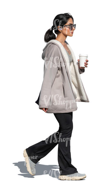 woman with a travel coffee cup walking