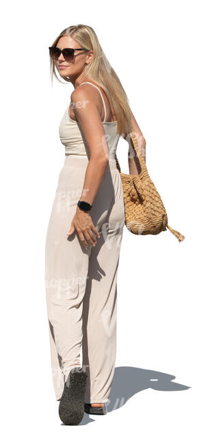 woman walking and looking back over her shoulder