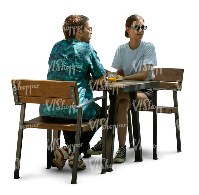 man and woman sitting in an outdoor cafeteria