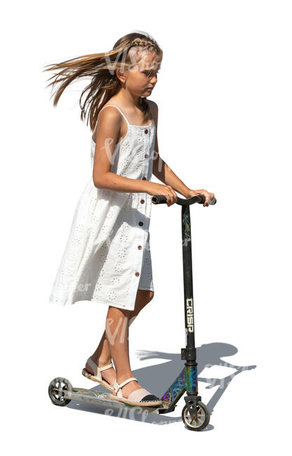 little girl in a summer dress riding a scooter